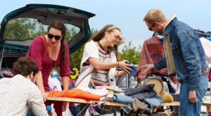 How to do a car boot sale woman smiling at car boot sale